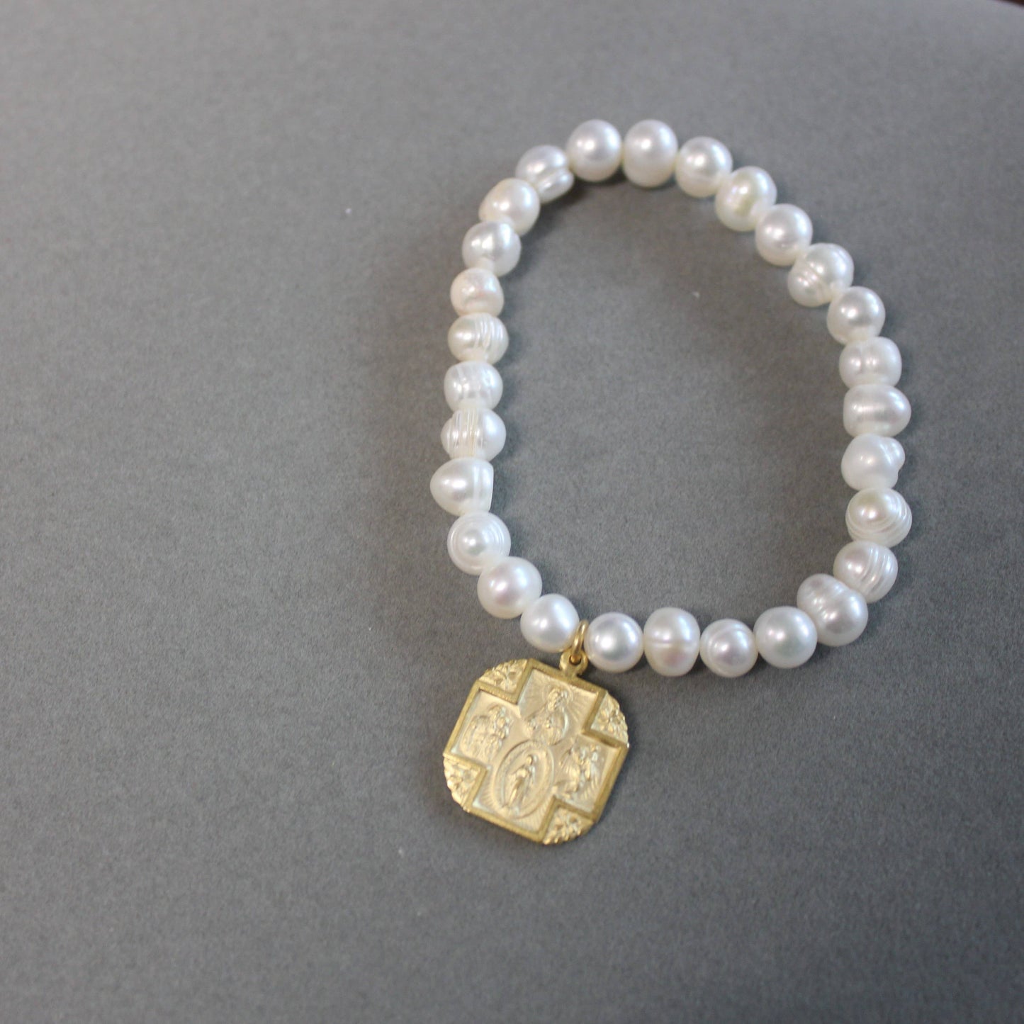 Pearl Stretch Bracelet with 4 Way Cross Medal